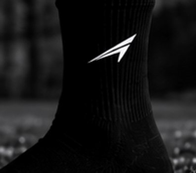 Black ACE sock on the pitch